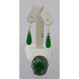 A GENEROUS JADE DRESS RING, enamelled with turquoise flora, size V 1/2, and a pair of jade EARRINGS