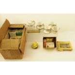 A QUANTITY OF 'PAINT YOUR OWN COTTAGE' in original boxes together with a miniature brass dolls