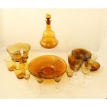 AN AMBER BLOWN GLASS DECANTER OF BELL FORM complete with stopper together with a quantity of AMBER
