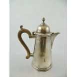 C.S. HARRIS & SONS A QUEEN ANNE STYLE SILVER HOT WATER POT having hinged domed lid with knop on a