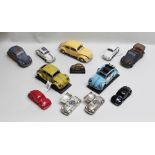 TWO FRANKLIN MINT DIE-CAST MODELS OF VW BEETLES, a plastic model of a VW Beetle, a resin model by