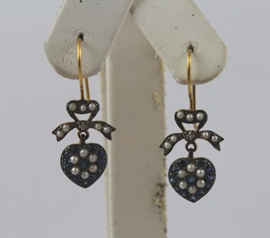 A PAIR OF "TENDER HEART" GOLD COLOURED METAL SET DROP EARRINGS, each having a heart set with