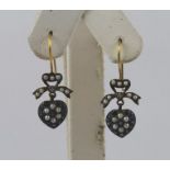 A PAIR OF "TENDER HEART" GOLD COLOURED METAL SET DROP EARRINGS, each having a heart set with