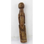 A BELIEVED LATE 19TH CENTURY CARVED AFRICAN FETISH/FERTILITY FIGURE of typical female form, 38cm