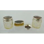A SILVER & TORTOISESHELL PART DRESSING TABLE SET comprising; two lidded lead crystal jars, a pin