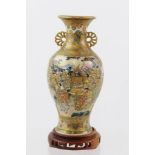 A MEIJI PERIOD JAPANESE MINIATURE SATSUMA VASE, profusely painted and gilded, the main body