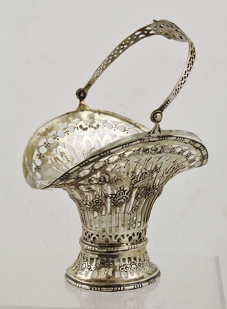 A CONTINENTAL WHITE METAL BONBON BASKET, pierced and cast with floral swags, swing handle and - Image 2 of 3