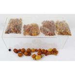 AN EXTENSIVE COLLECTION OF AMBER BEADS, mostly loose, various sizes, total weight 360g