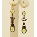 A PAIR OF ART NOUVEAU STYLE GOLD COLOURED METAL SET DROP EARRINGS, each set with two cabochon