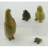 FOUR INUIT CARVED AND POLISHED STONE BIRDS, the tallest 29.5cm high