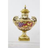 JOHN FREEMAN A ROYAL WORCESTER BONE CHINA PEDESTAL VASE, having detachable lid with finial,