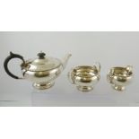 WALKER AND HALL A MID 20TH CENTURY THREE PIECE SILVER TEASET with beaded rims, comprising; teapot,