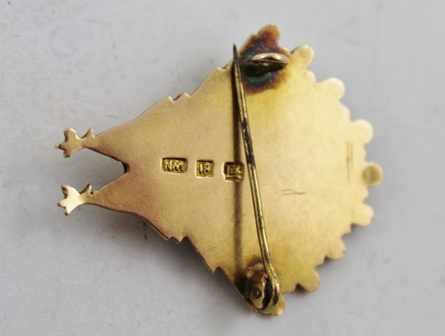 A RUSSIAN GOLD COLOURED METAL BROOCH, fashioned as a peacock with single red stone eye and tooled - Image 3 of 3