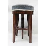 A 19TH CENTURY MAHOGANY FRAMED REVOLVING PIANO STOOL raised on squared tapering supports with