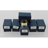 P** S** A SET OF SIX PLAIN SILVER BAND NAPKIN RINGS with display hallmarks, un-engraved, London