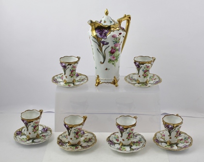 A HAND PAINTED JAPANESE COFFEE SERVICE IN THE ART NOUVEAU STYLE comprising; richly gilded coffee