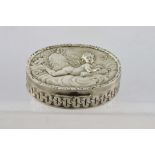 NATHAN AND HAYES AN EARLY 20TH CENTURY OVAL SILVER BOX, the hinged cover with repousse cupid