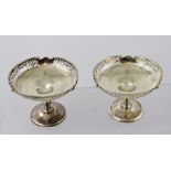 ELKINGTON & CO. A PAIR OF SILVER ELEVATED BONBONNIERES, each having a rolled and fretted rim, turned