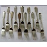 A COMPOSITE COLLECTION OF ELEVEN SILVER "FIDDLE" PATTERN DESSERT FORKS, mixed assays, 541g.