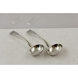 SIMON HARRIS A PAIR OF SILVER SAUCE LADLES with "fiddle" pattern decoration, London 1814, 17.5cm