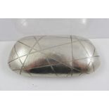 J**W** A SILVER CIGAR CASE having fancy shaped exterior with planished and geometric line engraved