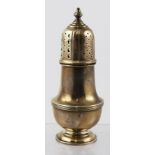 W.S. HUTTON & SONS A GEORGIAN STYLE SILVER SUGAR CASTER, having push fit lid with knop, reeded