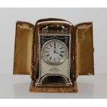 WILLIAM COMYNS A SILVER DRESSING TABLE TIMEPIECE, having hallmarked English case with swing handle