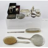 A MISCELLANY OF SILVER ITEMS, comprising four silver napkin rings, crested and monogrammed, two