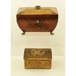 AN EARLY 19TH CENTURY TEA CADDY of sarcophagus shape, the lid with ring handle, fitted with two