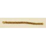 A CONTEMPORARY GOLD COLOURED METAL FANCY WIRE FLEXIBLE BRACELET of plaited tooled and hammered wired