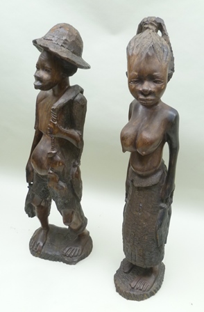 A PAIR OF 20TH CENTURY AFRICAN CARVED HARDWOOD FETISH OR FERTILITY FIGURES, in the form of a man and - Image 2 of 3