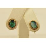 A PAIR OF GOLD COLOURED METAL STUD EARRINGS each set with opal doublet and fancy wire surround and