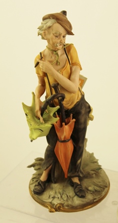 TWO CAPO-DI-MONTE PORCELAIN FIGURINES one signed by Nico Venzo, depicts a man with parasols, 26cm - Image 2 of 6