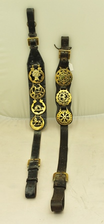 TWO 19TH CENTURY LEATHER MARTINGALE STRAPS, one mounted four brasses 108cm long, the other mounted 3