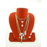 A COLLECTION OF FIVE NECKLACES variously set with moonstones and turquoise coloured stones, in rub-