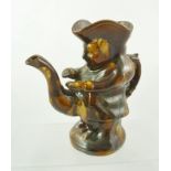 A 19TH CENTURY TREACLE GLAZED EARTHENWARE NOVELTY SNUFF TAKING TOBY JUG, the spout imaginatively