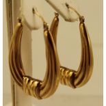 A PAIR OF GOLD COLOURED METAL GYPSY STYLE WIRE EARRINGS fashioned as wrapped hoops, 3g