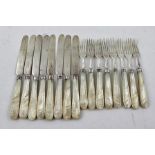 H** H** A SET OF EIGHT VICTORIAN SILVER AND MOTHER-OF-PEARL HANDLED FRUIT KNIVES AND FORKS, having