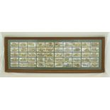 A FRAME OF WILLS CIGARETTE CARDS including First World War Military motor vehicles, 50 cards in