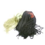 TWO HAND EMBROIDERED SHAWLS, one celadon green with summer flower decoration, deeply fringed, the