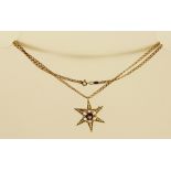 A VICTORIAN 15CT GOLD AMETHYST AND SEED PEARL SET BROOCH PENDANT fashioned as a six point star on