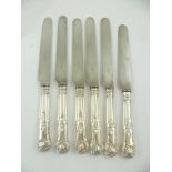 MARTIN HALL AND CO. A SET OF SIX VICTORIAN SILVER HANDLED DINNER KNIVES, Kings pattern with steel