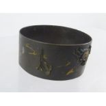 A LATE 19TH CENTURY MEIJI PERIOD JAPANESE SHIBAYAMA PATINATED BRONZE NAPKIN RING having gilt