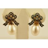 A PAIR OF VICTORIAN STYLE DIAMOND AND PEARL EARRINGS each having a diamond set stud with butterfly