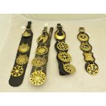 A COLLECTION OF FOUR 19TH CENTURY LEATHER MARTINGALE STRAPS each with buckle end and each mounted