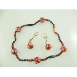 A MURANO LAMPWORK NECKLET with cherry red applied flowers and matching drop EARRINGS