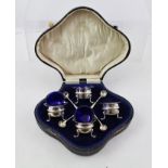 WILLIAM AITKEN LTD. A SET OF FOUR SILVER SALTS, each having wavy rim, blue liner, banded body,