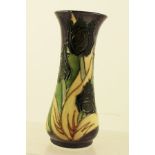 A MOORCROFT POTTERY VASE of waisted form, painted and tube lined in the Black Tulip pattern,