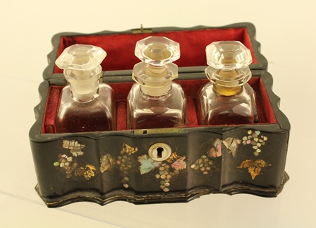 A LATE 19TH CENTURY PAPIER MACHE BOX containing three scent bottles with stoppers, casket is - Image 5 of 5