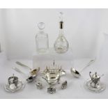 A SELECTION OF PLATED WARES to include; three ladles, a toast rack, two glass decanters, sauce